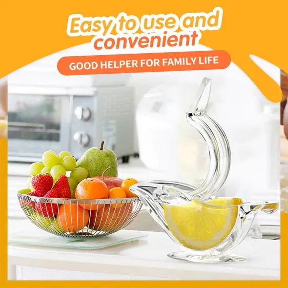 Transparent acrylic manual lemon juicer in the shape of a bird on a kitchen counter.