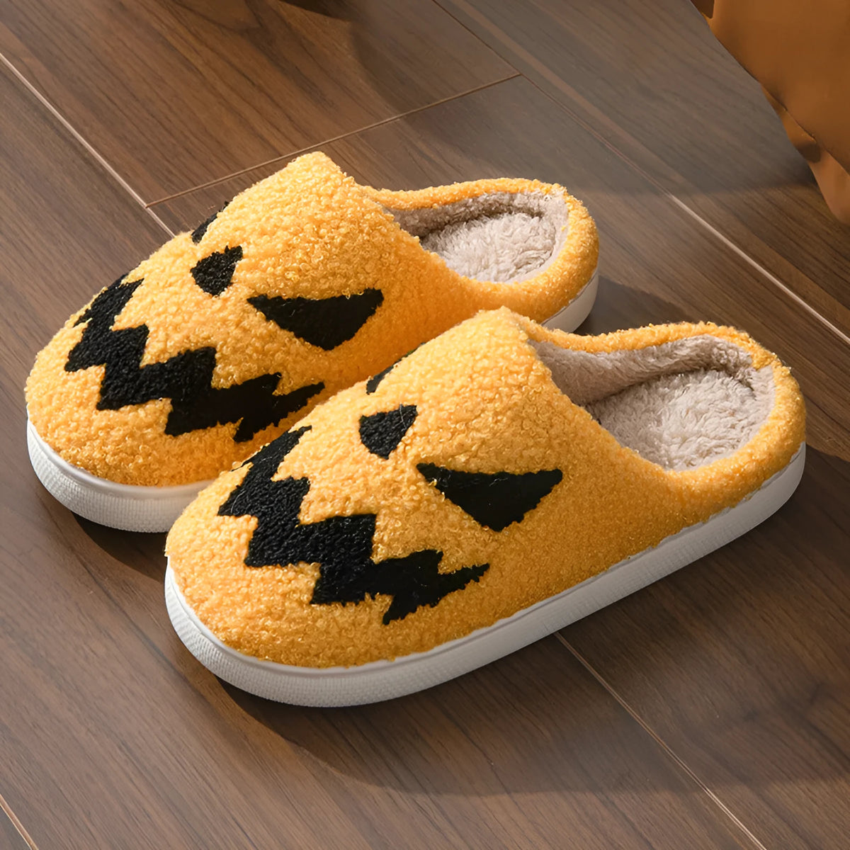 Halloween couple indoor slippers with embroidered lightning ghost face on suede upper in various colours.
