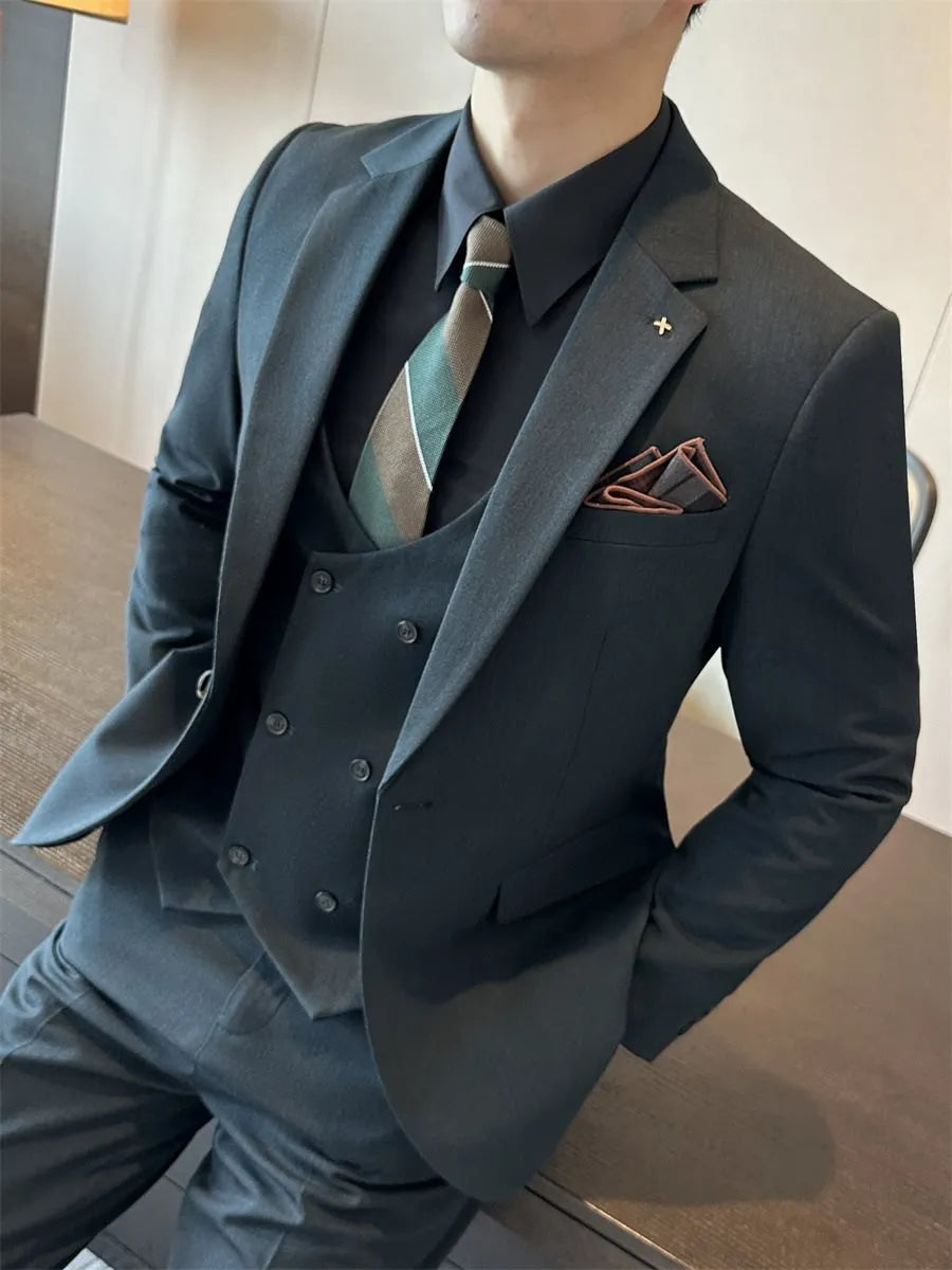 Men's slim fit business suit jacket in dark green, shown on a hanger.