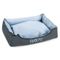 Soft grey dog bed with raised edges and a removable plush cover, shown in medium size.