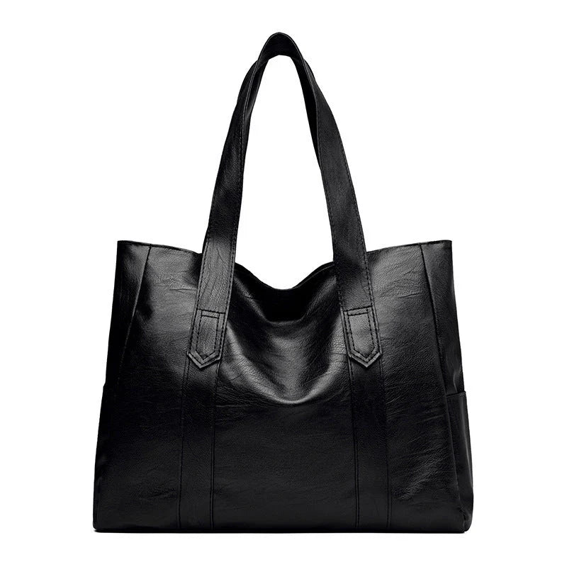 Large capacity commuter tote bag in brown and black with double shoulder straps and mobile phone pocket
