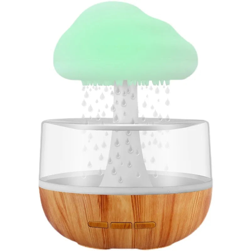 White cloud-shaped humidifier with night light and water drop effect on a table