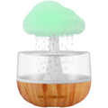 White cylindrical aromatherapy humidifier with coloured night light and USB cable