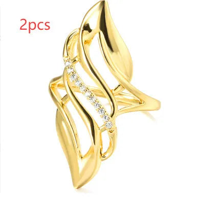 Women's exaggerated curve copper ring with zircon treatment in gold colour
