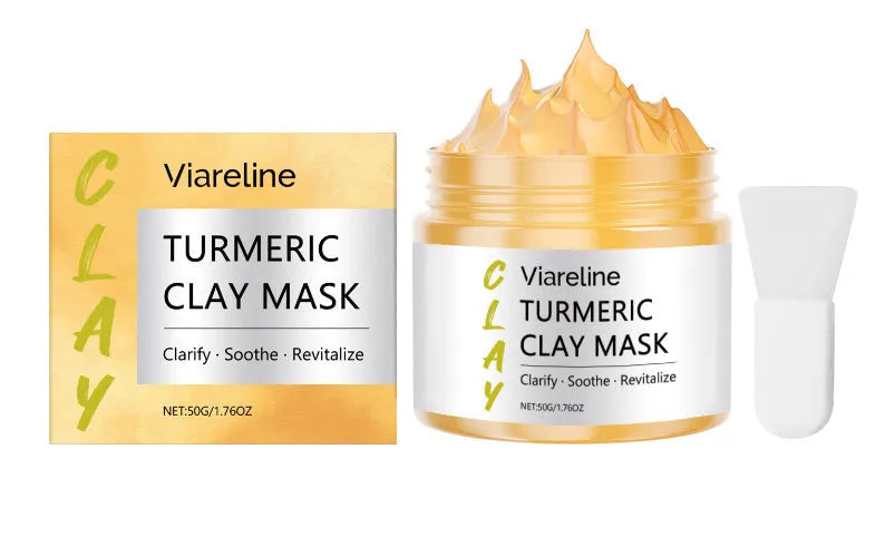 Yellow turmeric mud face mask in jar with applicator brush