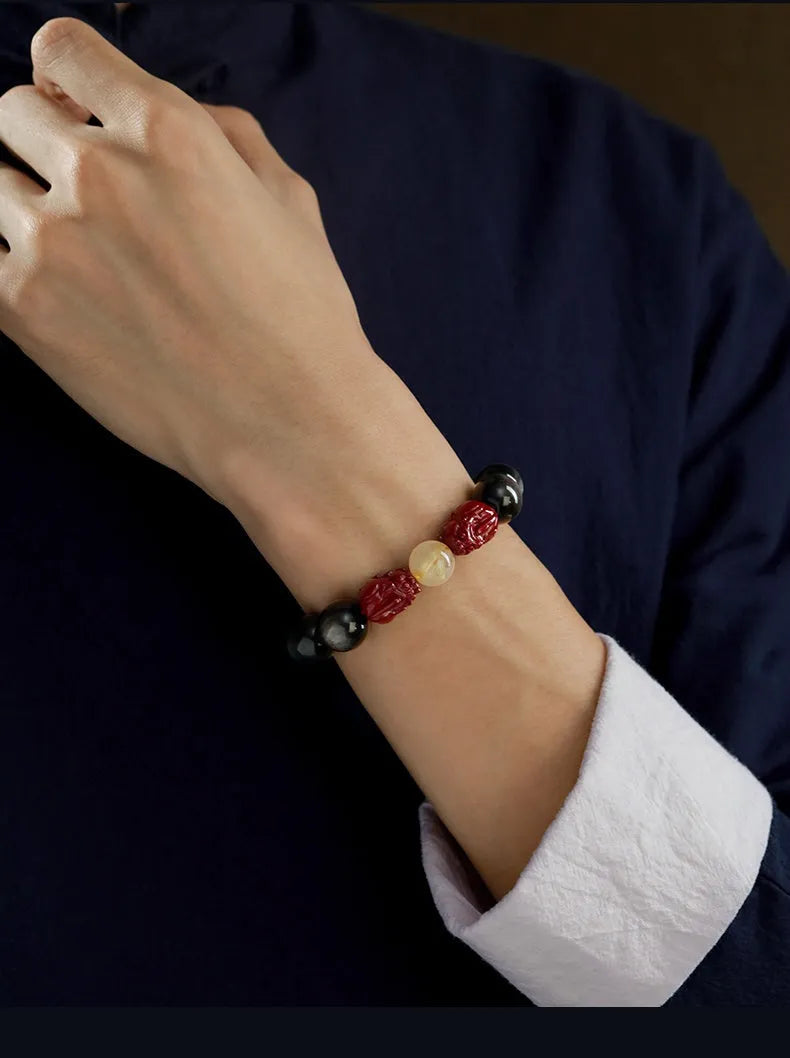 Hand-carved cinnabar beads bracelet with Jinniu design in silver gift box