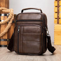 Men's vintage brown genuine leather shoulder bag showing vertical square shape and front zipper.