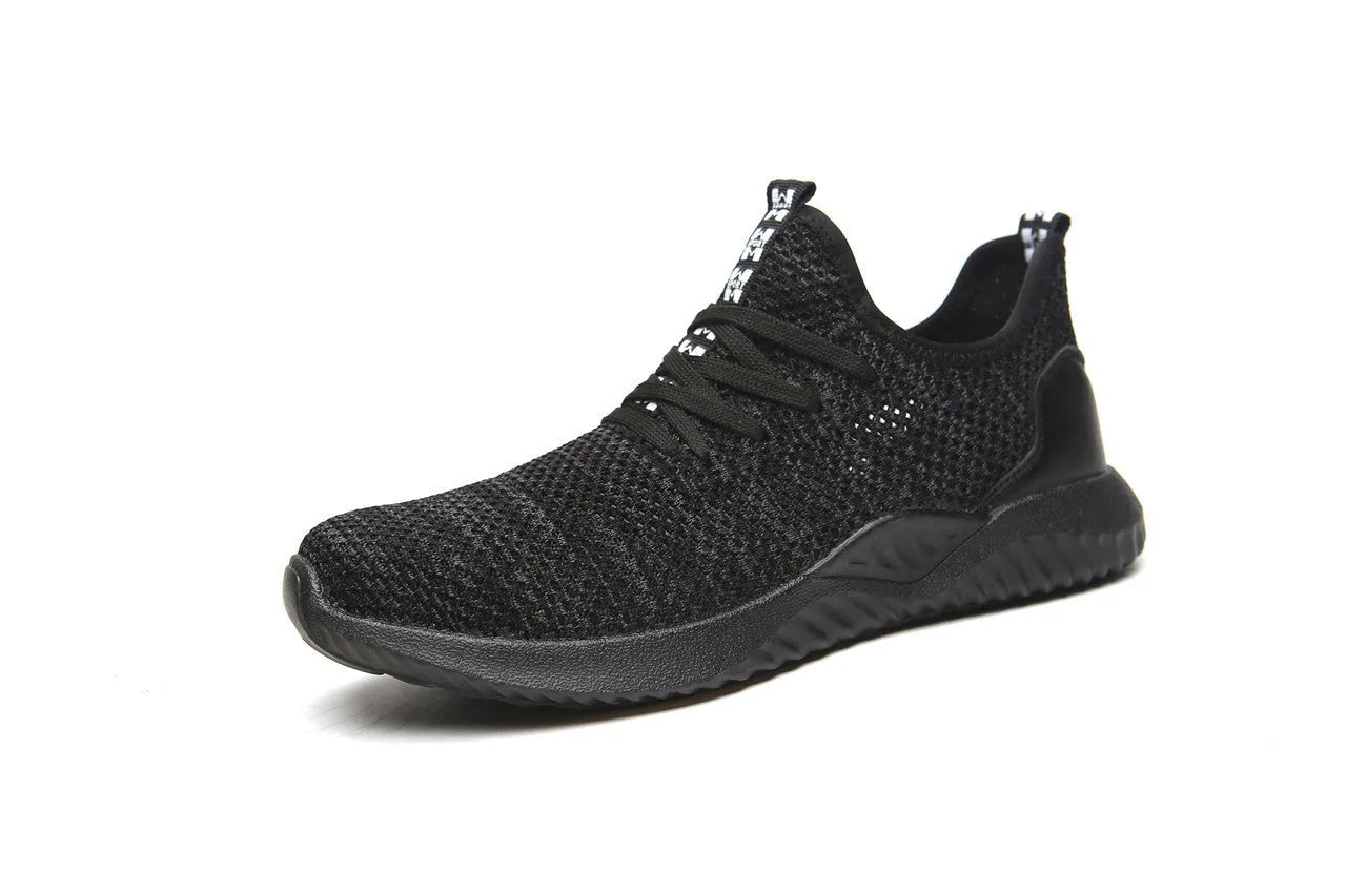 Black steel toe cap safety shoes with low-cut design on a work site background.