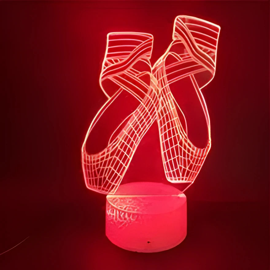 3D ballet dancer silhouette night light on a base with remote control, showing multiple colour options.