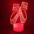 3D ballet dancer silhouette night light on a base with remote control, showing multiple colour options.