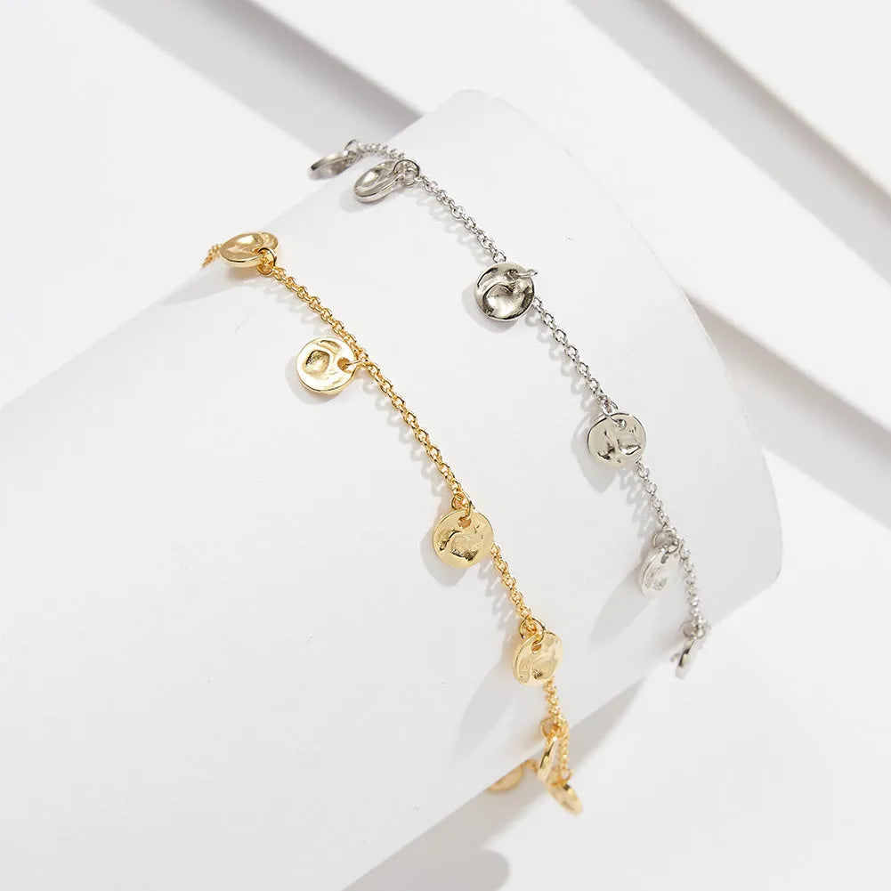 Women's S925 silver anklet with round geometry links in Han style, shown in gold and platinum colour options.
