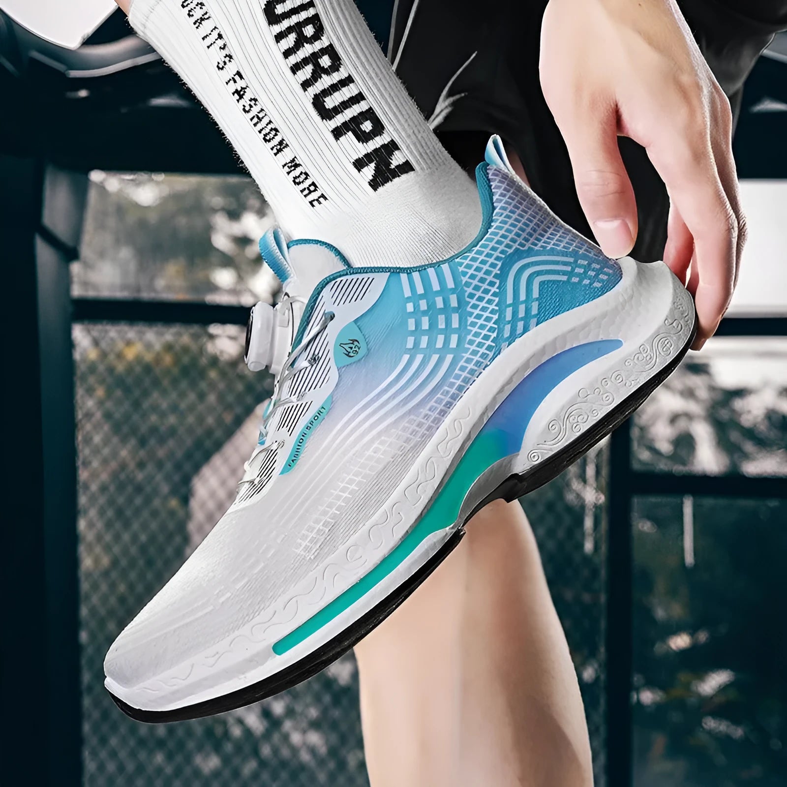 Men's white and blue low-top sneakers with a rotating buckle and mesh lining.