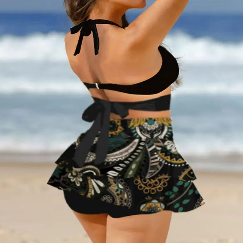 Women's purple bikini swimsuit with matching skirt showing lace-up design and high-waist brief style