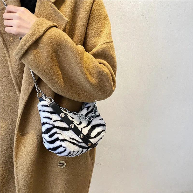 Leopard pattern plush shoulder bag with adjustable chain strap and velvet texture