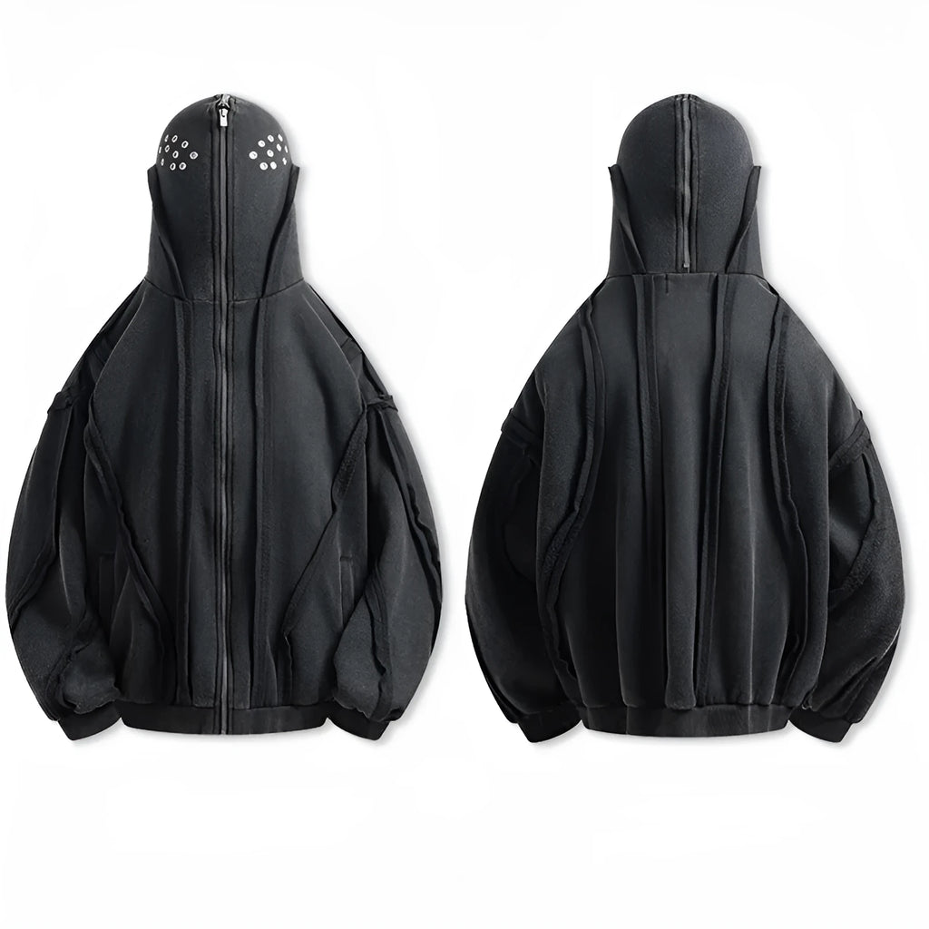 Black loose-fit padded cotton cardigan with a zip front and hood on a model.