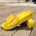 Women's grey blue buckle slipper with adjustable strap and soft EVA sole.