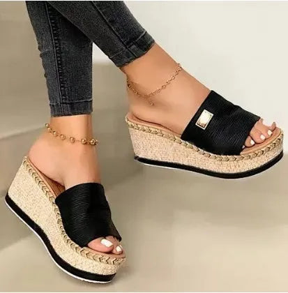 Platform wedge heel sandals with cloth upper in black, side view showing plain pattern and metal element detail