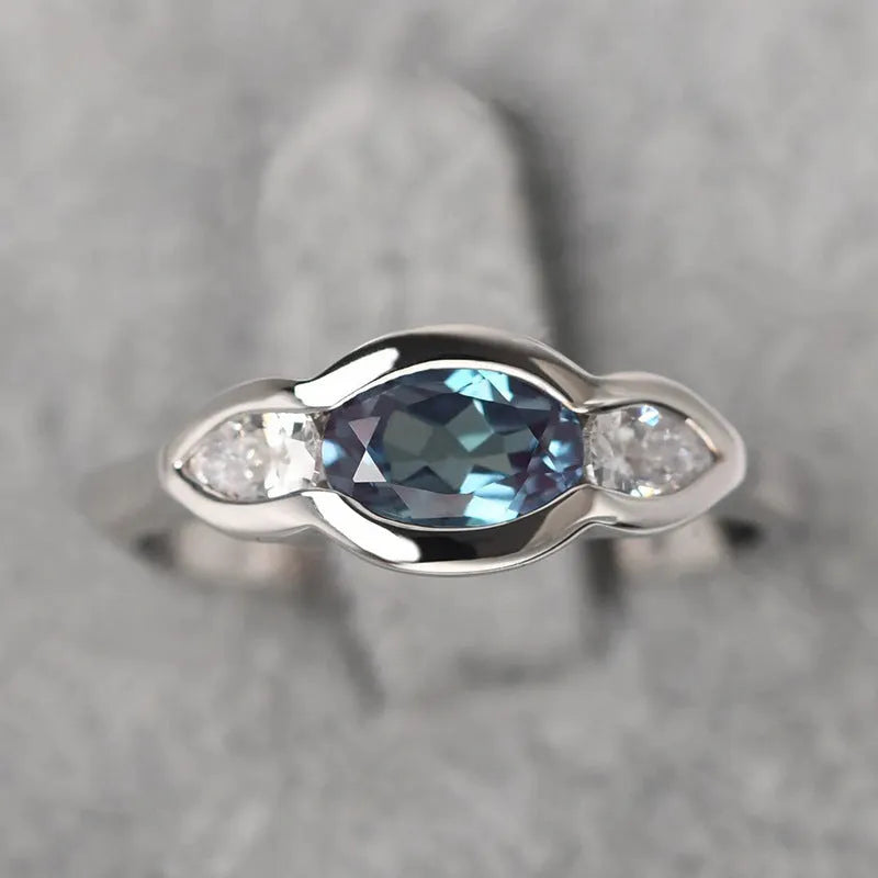 Women's geometric ellipse ring with zircon stone in white gold colour finish on model finger