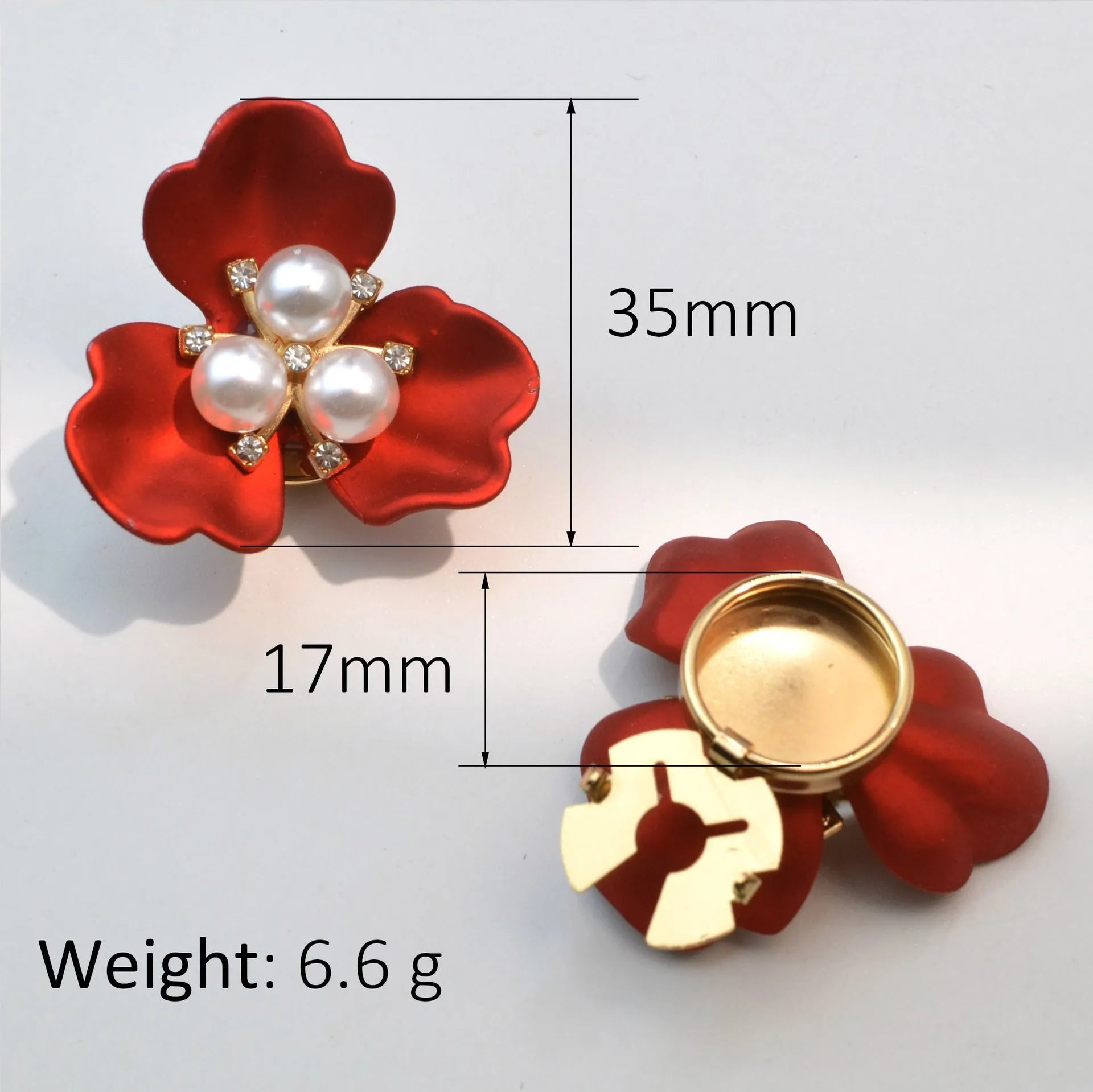 Metal cufflinks with pearl three-flap design in gold, pink, red, and white colours on white background