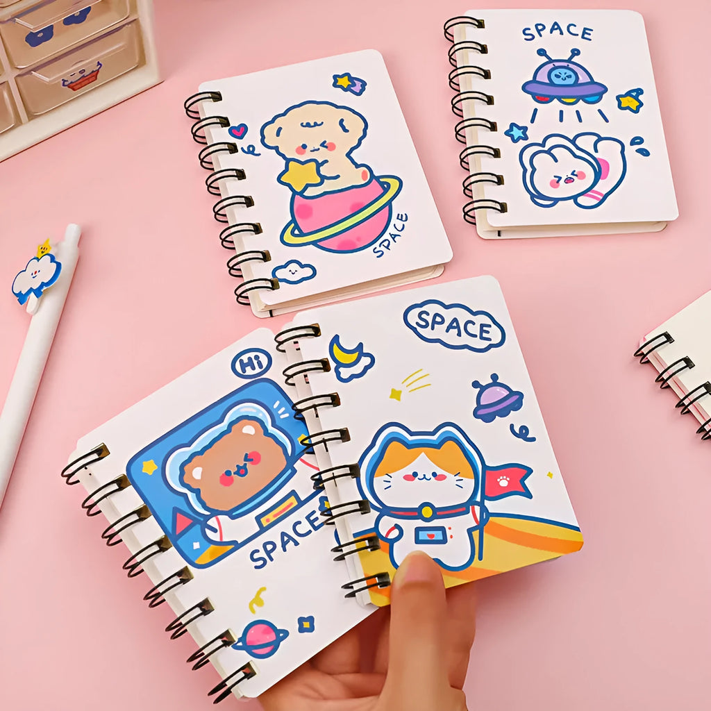 Astronaut themed pocket flipper notebook showing 10.5 by 8 cm dimensions with space cat cover design