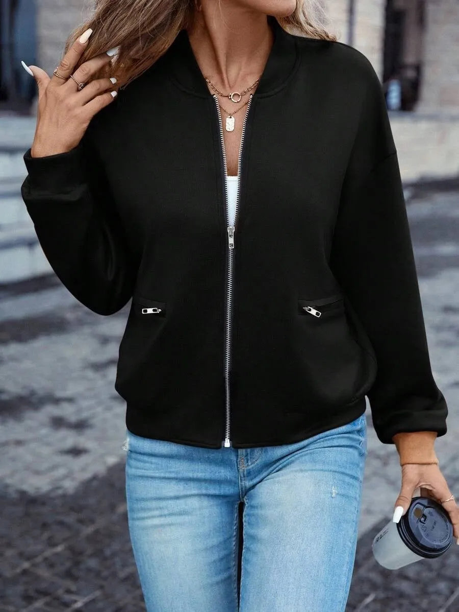 Solid black women's zip jacket with long sleeves and faux pocket details on front.