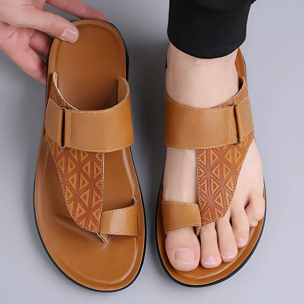 Men's simple cowhide beach slippers with open toe and rubber sole in light brown.