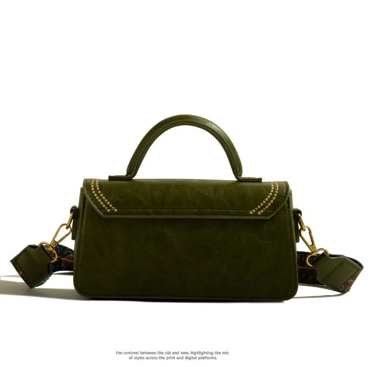 Brown retro messenger bag for women showing square vertical shape and external pocket