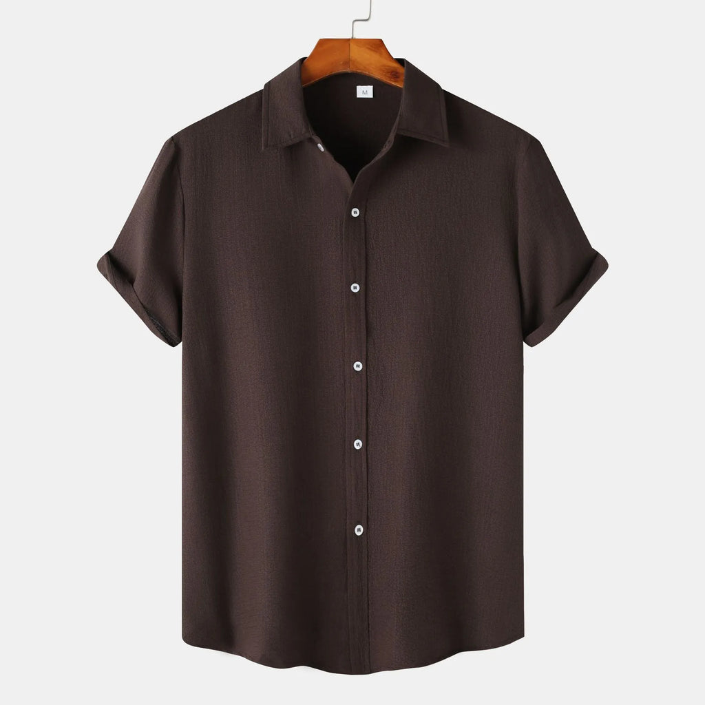 Man wearing a short-sleeved casual cardigan-style shirt in a GKESJ colour.