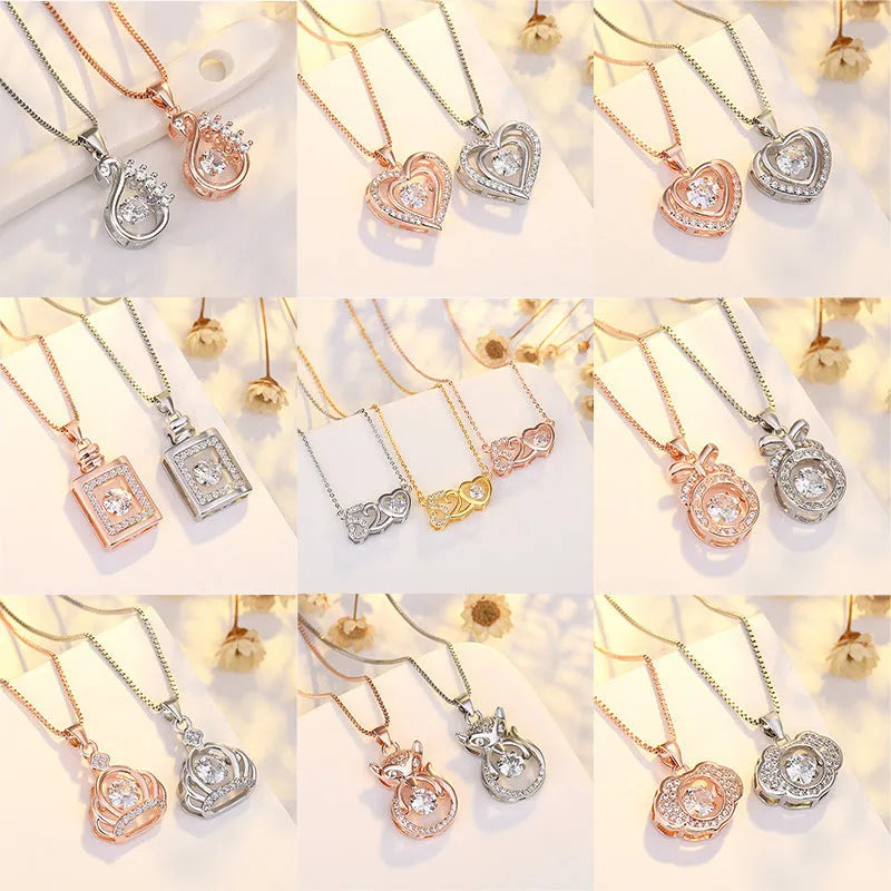Silver heart-shaped necklace with crown and bow charms on clavicle