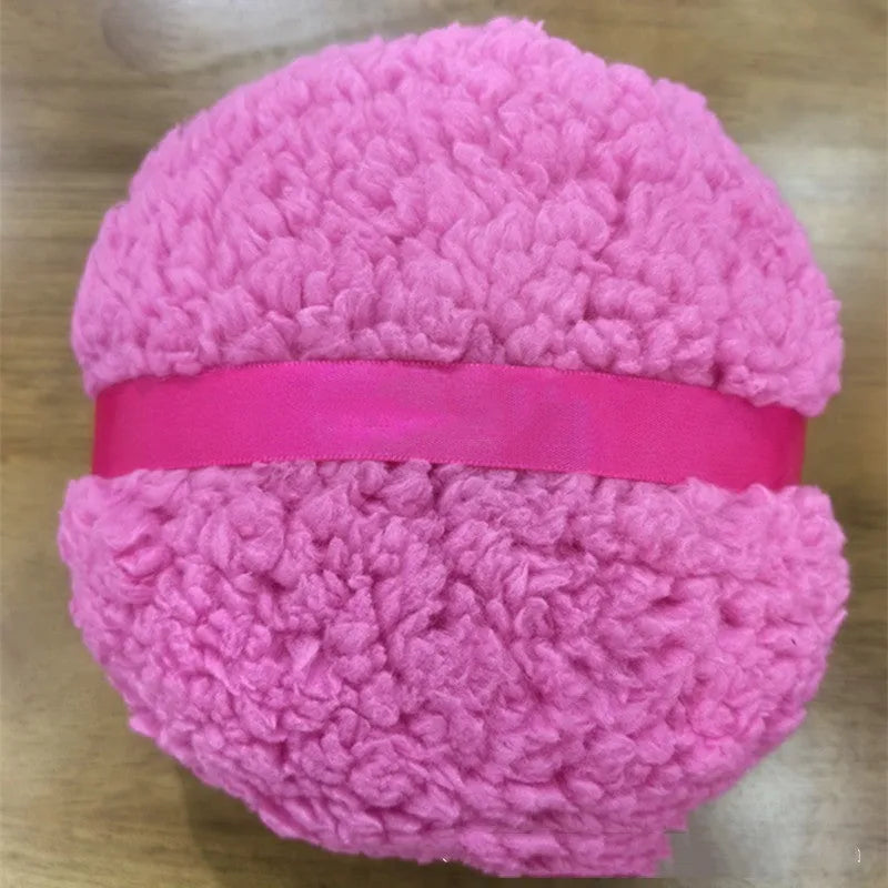 Oversized rectangular plush powder puff for dry makeup application on a white background.