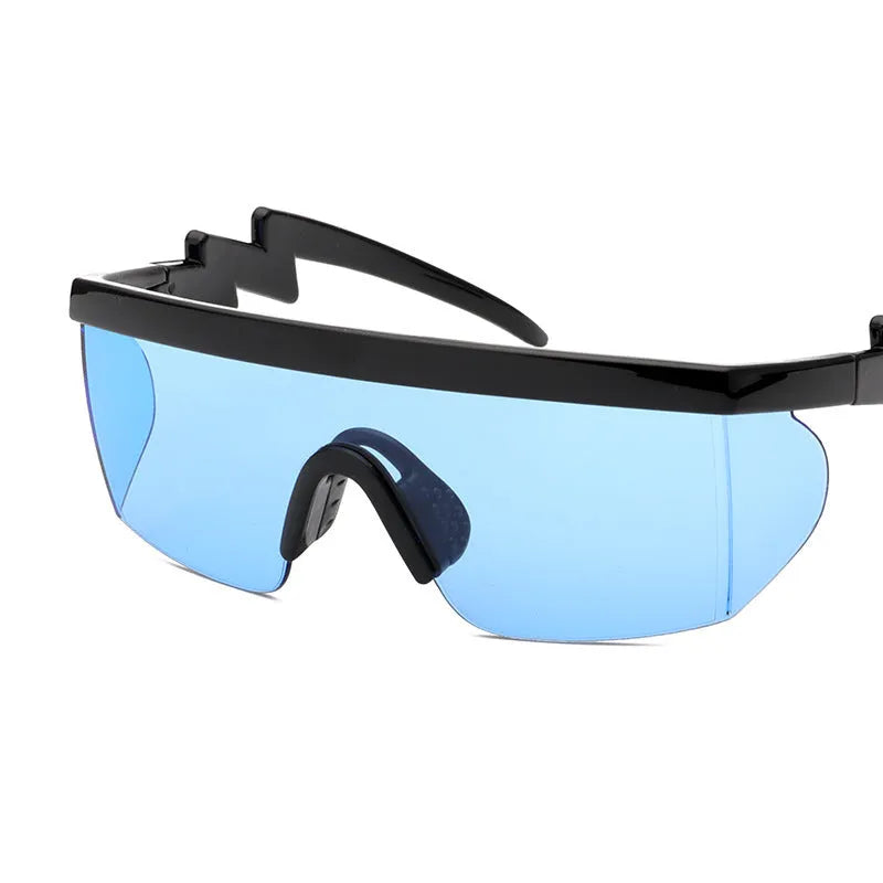 Sports sunglasses with curved foot piece design showing colourful film lenses and UV400 protection in PC frame