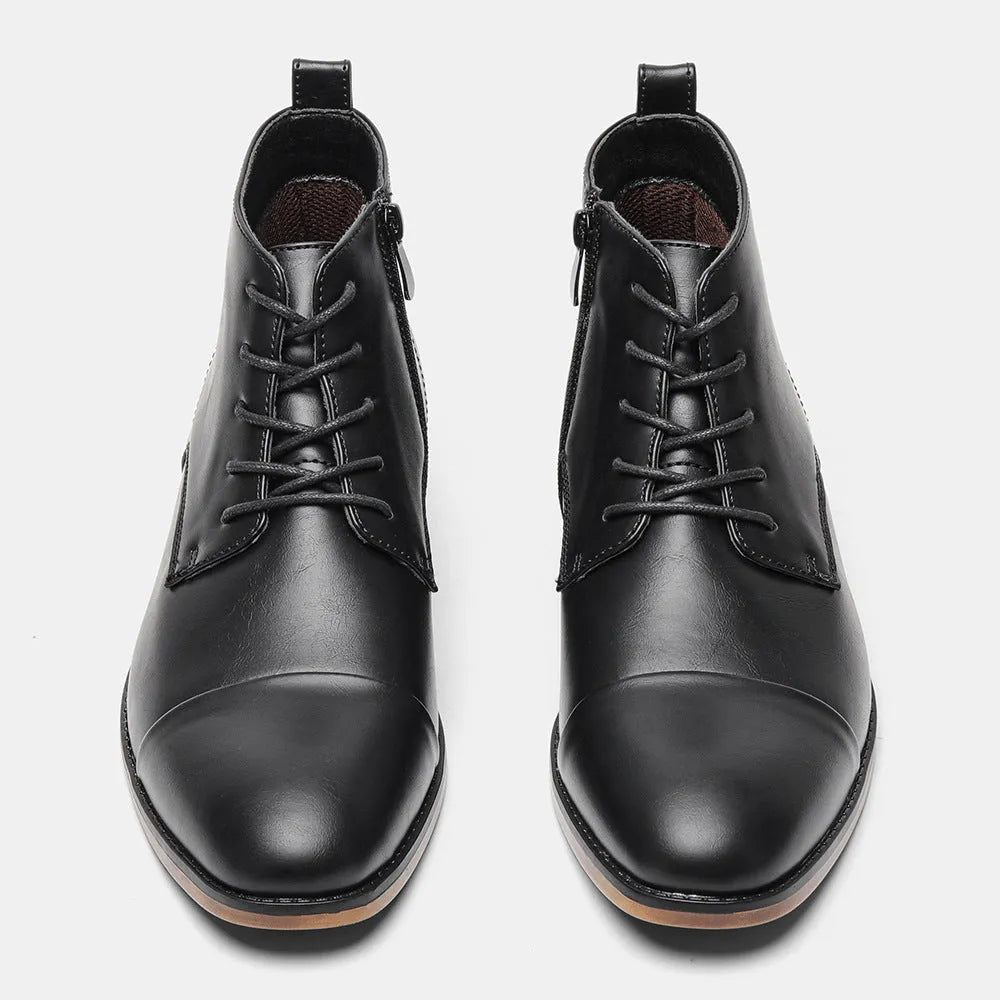 Men's brown Chelsea ankle boots with a side zip, shown on a foot.