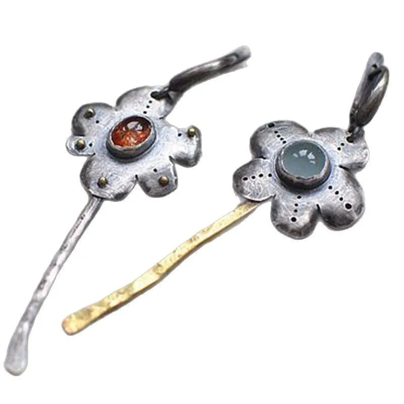 Long geometric flower earrings with retro styling and asymmetric two-colour electroplated finish