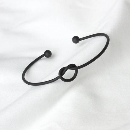 Knotted Knot O-Type Metal Openwork Bracelet in various colours, showcasing unique openwork design