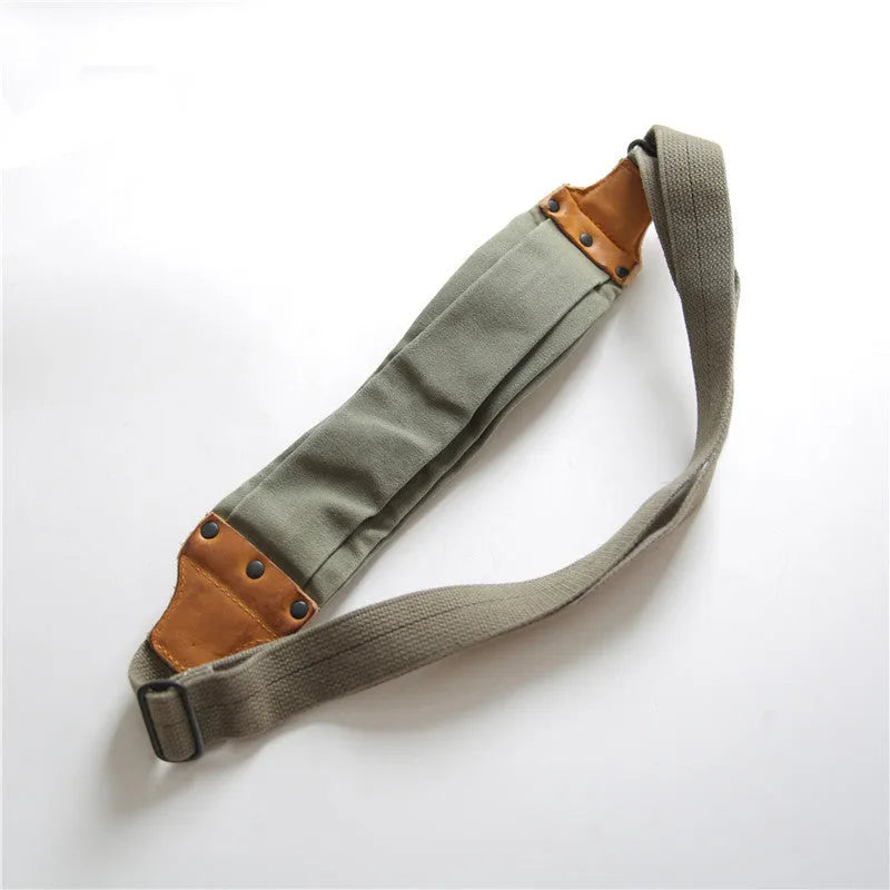 Green retro military style chest bag with washed canvas and cowhide leather detailing