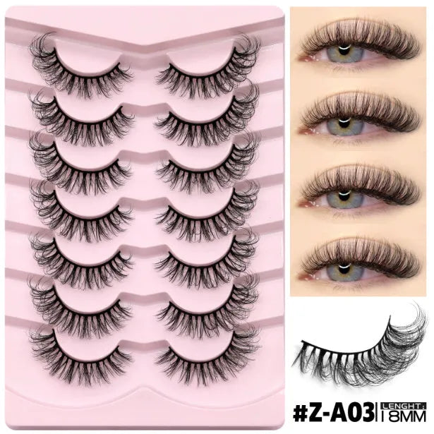 Box of natural long style false eyelashes with thick, dense artificial fibres and included glue.