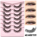 Box of natural long style false eyelashes with thick, dense artificial fibres and included glue.