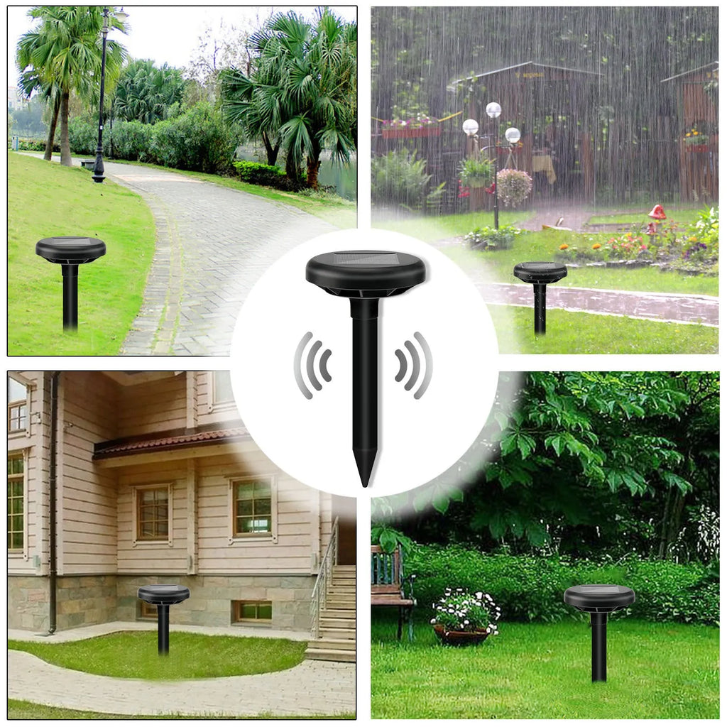 Solar ultrasonic mouse repeller with black solar panel and battery unit on grassy ground