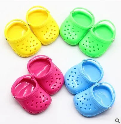 Colourful plastic doll beach slippers accessory in blue, red, yellow, green