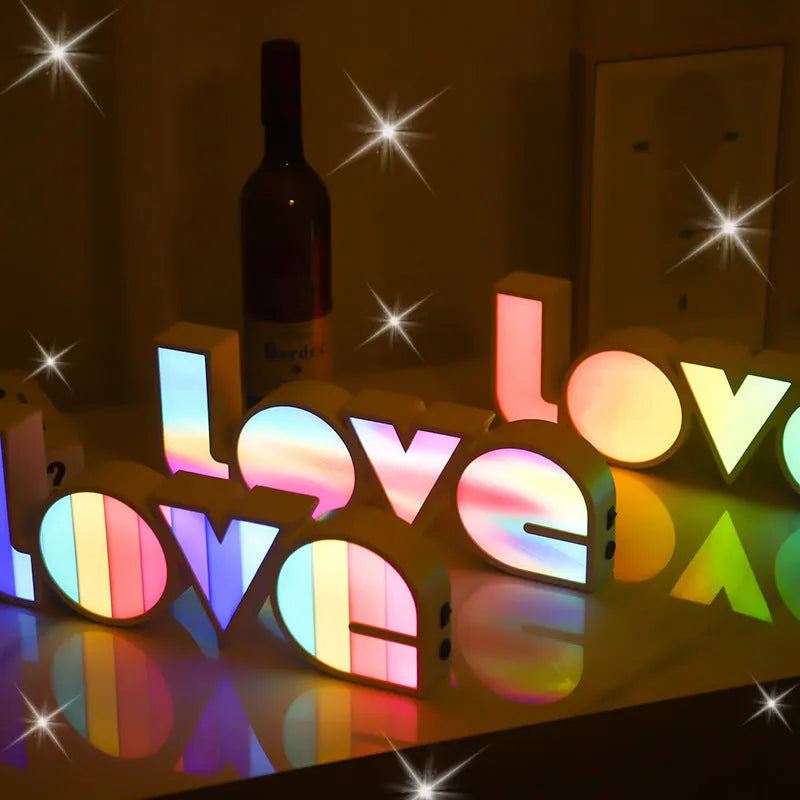 Rainbow halo style LED LOVE light sign measuring 35.5 x 13.5 cm for Valentine's Day decoration