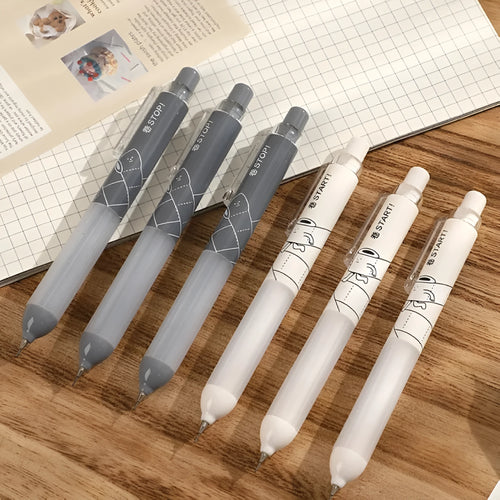 Black and white 0.5mm mechanical pencils with a soft grip section and push-button top.