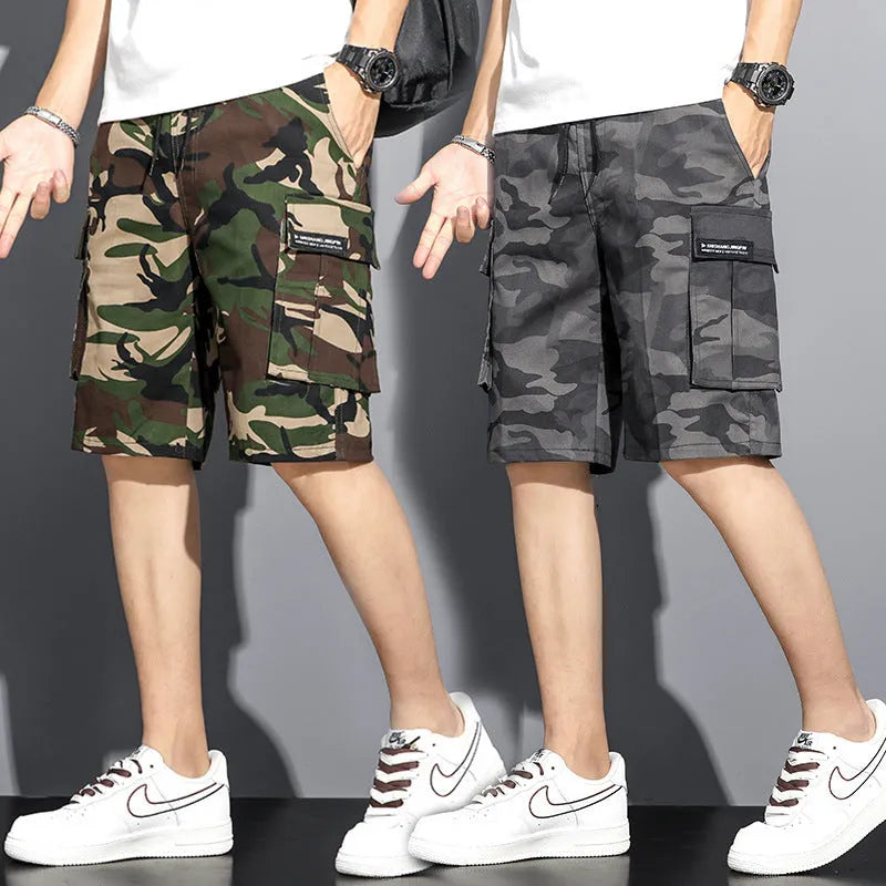 Men's camouflage 5-point workwear shorts in green, front view, with drawstring waist and mid-thigh length