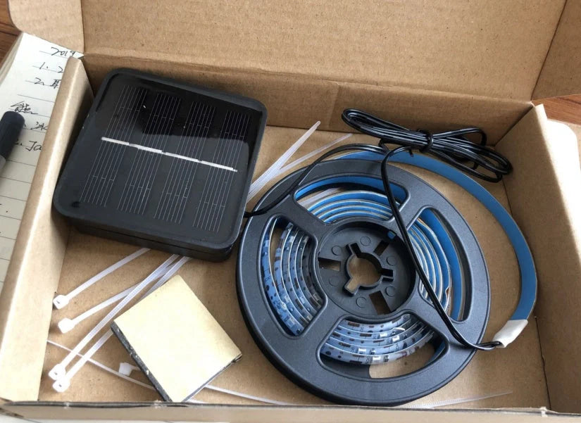 Induction Color Changing Basketball Frame Light attached to a basketball rim, illuminating at night