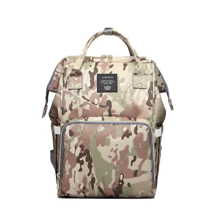 A stylish and practical mummy backpack with features like an insulated bottle compartment, USB charging port, and water-resistant construction.