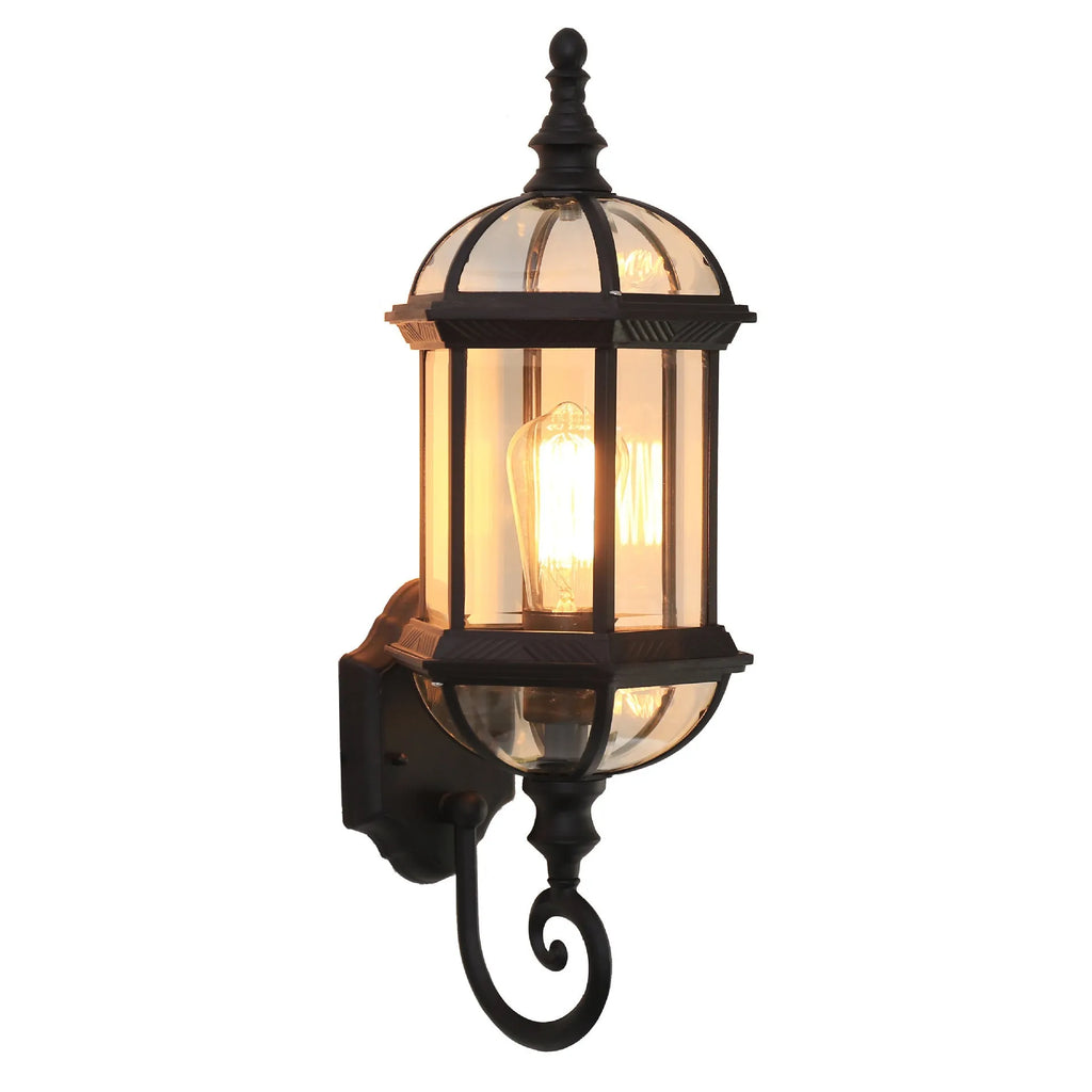 Outdoor aluminium wall lamp with three-layer design in black finish mounted on a courtyard wall