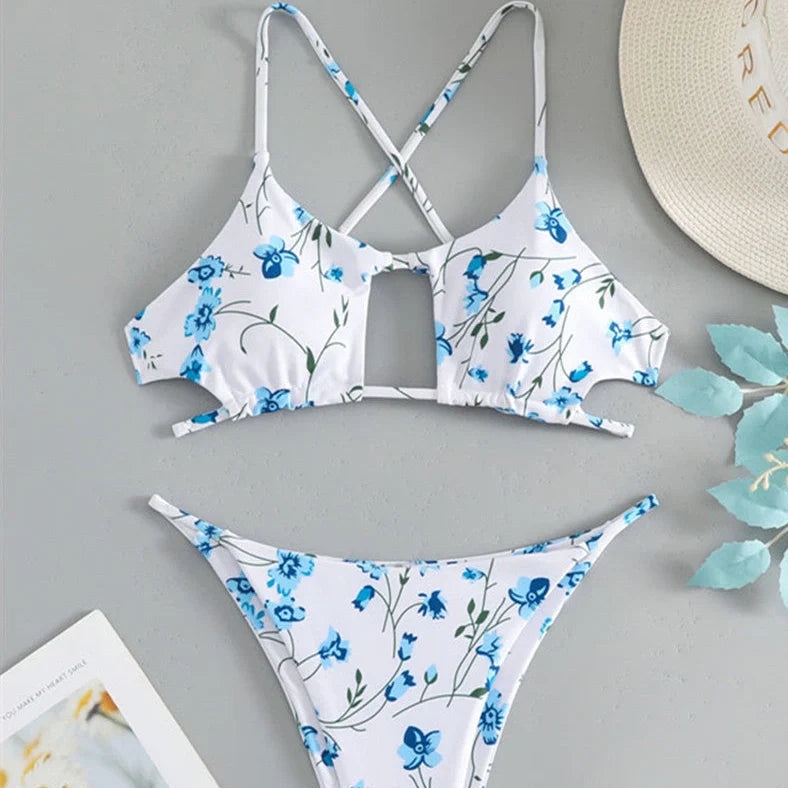 Women's floral pattern tie-neck triangle swimsuit with matching shorts on mannequin