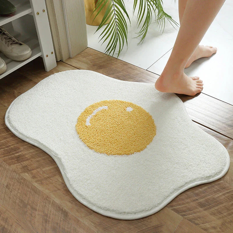 Stylish egg-shaped entrance mat made of premium polyester fabric with non-slip rubber backing, available in various sizes and colors to suit any Kiwi home's decor