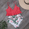 Ruffled nylon swimsuit with steel support and floral lotus print in red, showing ruffled neckline and built-in pads