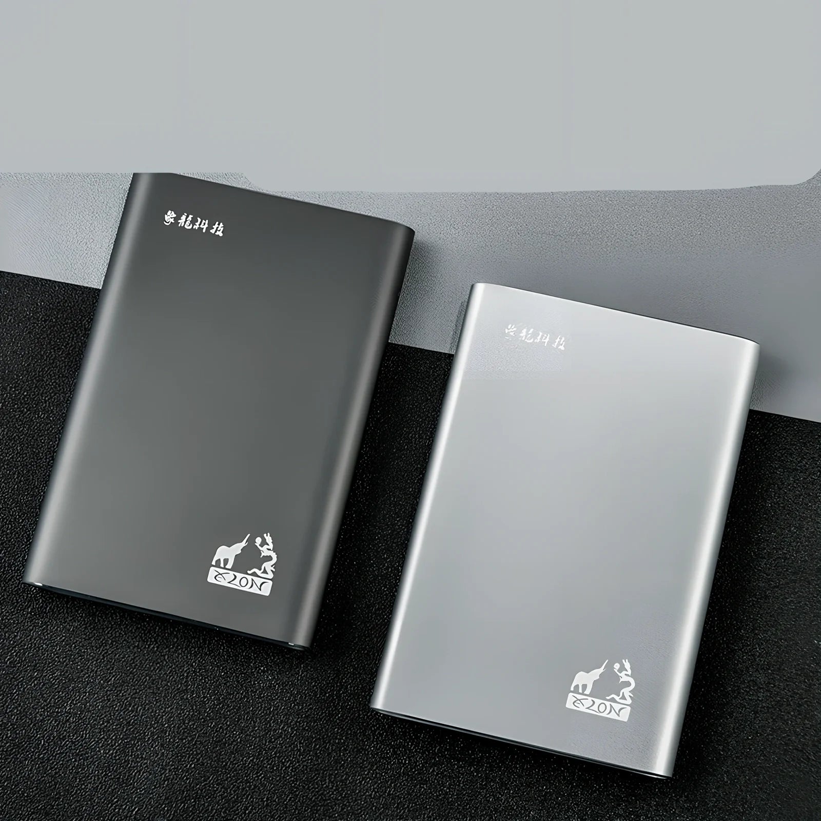 Black and silver 2.5-inch metal mobile hard drive with USB 3.0 connector showing activity light