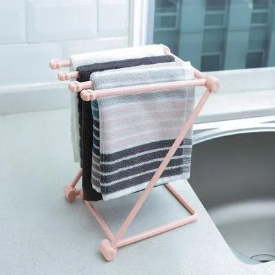 Foldable plastic dishcloth shelf in Nordic colours for kitchen bottle storage